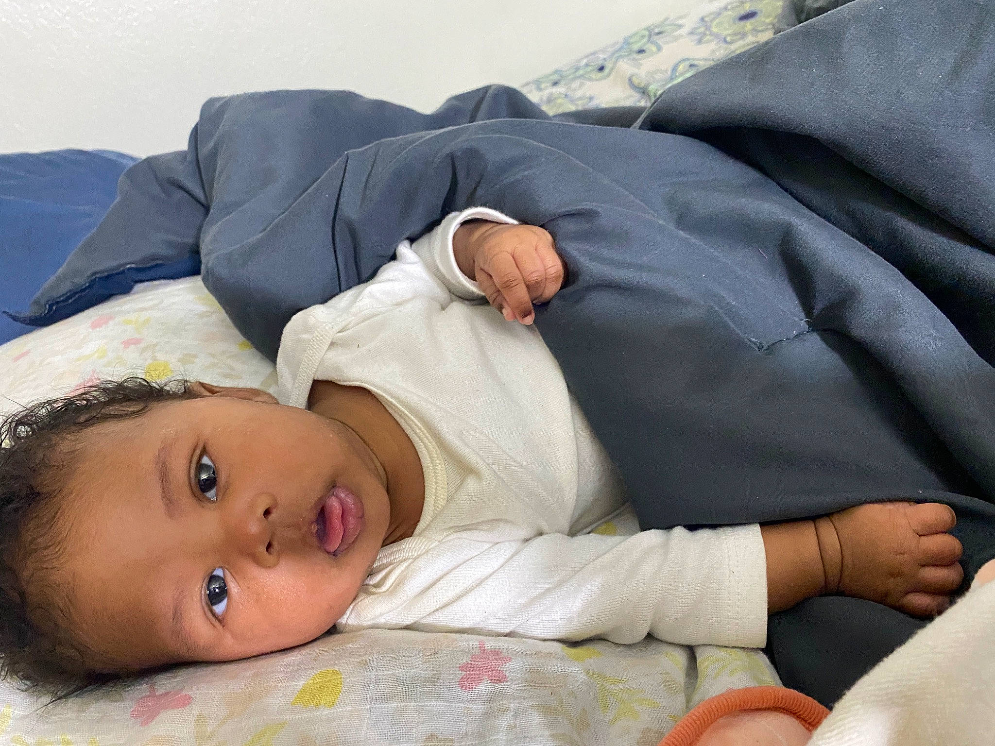 River is registered to the contest to win money with this photo: baby, baby_products, baby_sleeping, baby_toddler_clothing, bedding, bedtime, blanket, child, comfort, couch, eyelash, face, grass, hat, linens, nap, person, room, sitting, sleep