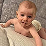 arm, baby, blanket, child, couch, crawling, cute, expression, eyes, face, hand, head, home, indoors, infant, naked_torso, person, skin, texture, young