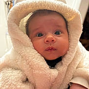 Benjamin joined the competition — help win amazing prizes! baby, child, face, hood, coat, white, fur, cute, curious, indoor, warm, clothing, person, portrait, small, hands, soft, winter, closeup, expression