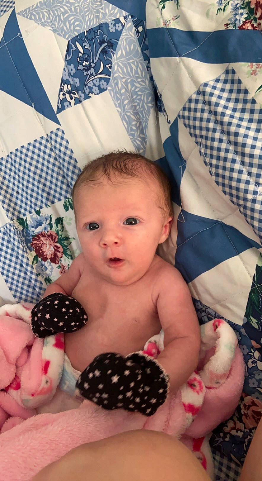 Kamdyn is registered to the contest to win money with this photo: baby, baby_toddler_clothing, cheek, chest, child, comfort, eye, finger, happy, head, linens, nail, pattern, person, pink, product, skin, textile, thumb, toddler