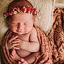 newborn, baby, sleeping, flower_crown, blanket, basket, cozy, knitted, infant, wrapped, peaceful, soft, cute, small, hands, feet, portrait, indoors, warm, resting