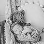 Delaney is registered to the contest to win money with this photo: baby, newborn, sleeping, teddy_bear, blanket, knitted, lace, chair, vintage, black_and_white, portrait, peaceful, cute, infant, headband, soft, cozy, wrapped, child, indoors