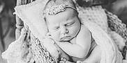 Delaney joined the competition — help win amazing prizes! baby, newborn, sleeping, basket, blanket, headband, flower, black_and_white, portrait, infant, cute, peaceful, wrapped, skin, toes, hands, soft, knitted, cozy, closeup