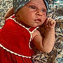 baby, child, infant, headband, red_dress, blue_headband, stars, blanket, floral_pattern, skin, face, hand, lying_down, closeup, portrait, cute, indoors, expression, young, person