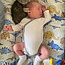 Aaron a rejoint le concours — aidez-le/la à gagner de superbes lots ! baby, kitten, sleeping, onesie, dinosaur_pattern, blanket, paw, infant, cute, animal, pet, child, resting, soft_toy, colorful, cozy, indoor, newborn, toddler, peaceful