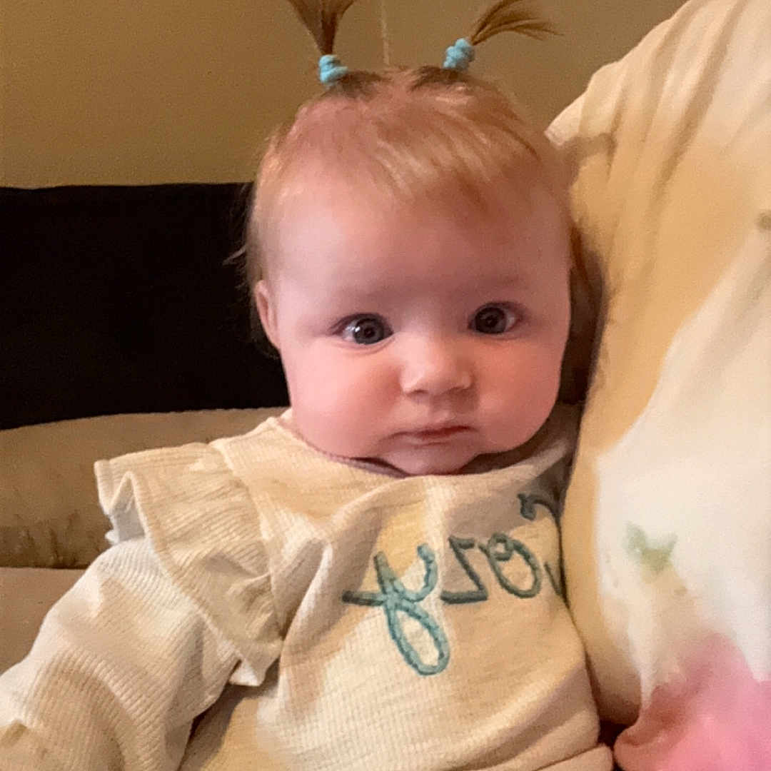 Myla joined the competition — help win amazing prizes! baby, bed, bedroom, blanket, bodypart, couch, cushion, face, finger, furniture, hand, happy, head, homedecor, newborn, person, photography, portrait, sitting, smile