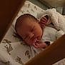 Cataleya participe au concours pour gagner de l'argent avec cette photo : newborn, baby, sleeping, blanket, crib, infant, cozy, animal_print, soft, peaceful, hand, face, bed, rest, child, indoors, quiet, warm, comfort, portrait
