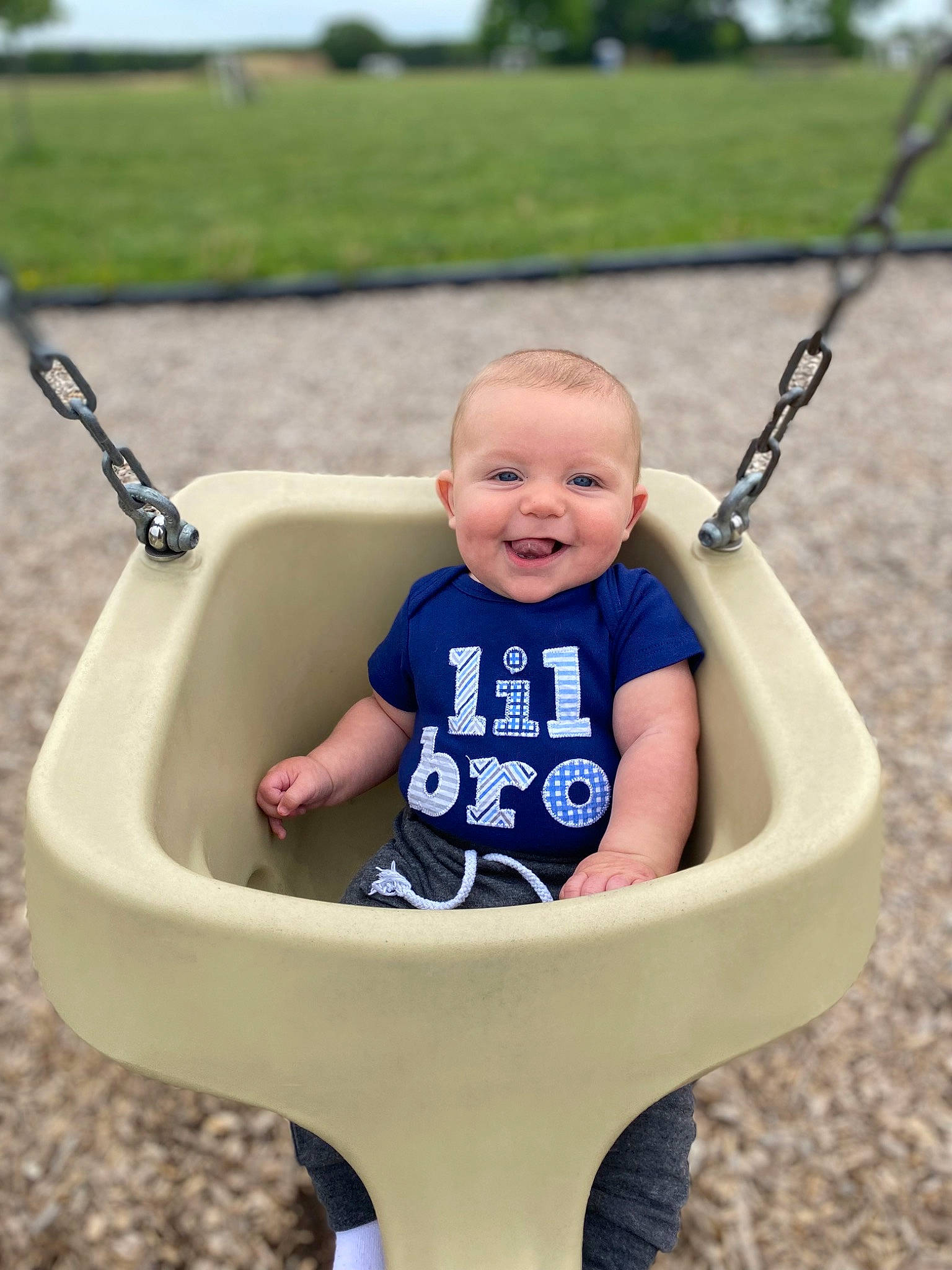 Jack is registered to the contest to win money with this photo: arm, blue, clothing, eye, face, facial_expression, green, hairstyle, hand, head, human, jeans, joy, organ, person, photograph, plant, product, skin, smile