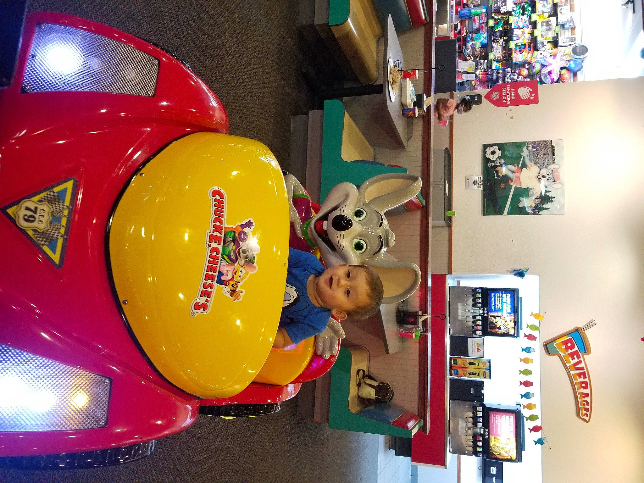 Isiah joined the competition — help win amazing prizes! art, automotive_design, automotive_exterior, automotive_lighting, bumper, classic, classic_car, event, fender, hat, headlamp, hood, luxury_vehicle, motor_vehicle, person, red, shelf, shelving, toy, vehicle