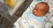Tayshawn is registered to the contest to win money with this photo: baby, babycare, bassinet, bed, blanket, bottle, face, formula, healthcare, hospital, infant, newborn, nursery, peaceful, plastic, room, sink, sleeping, swaddled, wrapped