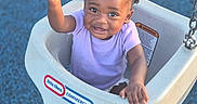 Kyzez Nicole Cox joined the competition — help win amazing prizes! baby, chain, child, cute, daylight, expression, foot, hair_puffs, happy, outdoor, person, play, playground, purple_shirt, reaching, seat, smiling, swing, toddler, toy