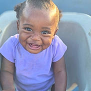 Kyzez Nicole Cox is registered to the contest to win money with this photo: baby, child, curly_hair, cute, expression, face, hands, happy, infant, joy, outdoor, person, playful, portrait, purple_shirt, seat, smiling, sunlight, toddler, young_child