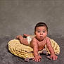 Isaiah is registered to the contest to win money with this photo: baby, infant, diaper, blanket, knitted, tummy, curious, child, cute, indoor, portrait, soft, hands, face, expression, young, person, crawling, cozy, studio