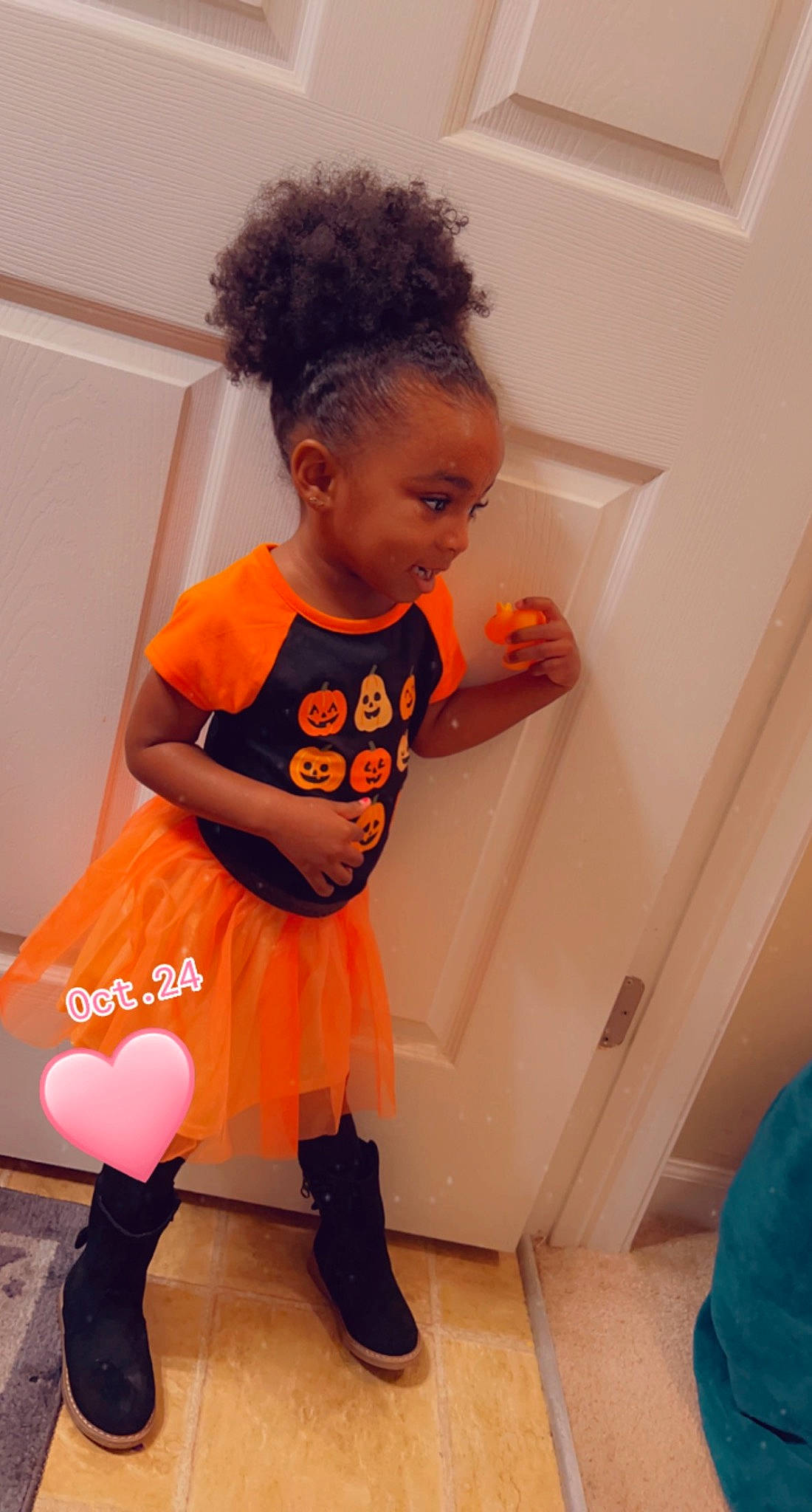 Ariana joined the competition — help win amazing prizes! baby, baby_toddler_clothing, bathroom, child, floor, flooring, fun, happy, human_leg, joint, knee, orange, person, pink, plumbing_fixture, room, shoulder, sleeve, sock, thigh