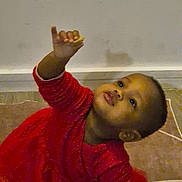 Fatoumata a rejoint le concours — aidez-le/la à gagner de superbes lots ! child, toddler, red_dress, curious, indoor, carpet, reaching, kneeling, young_child, person, cute, portrait, floor, wall, long_sleeves, playful, baby, looking_up, small_hand, expression
