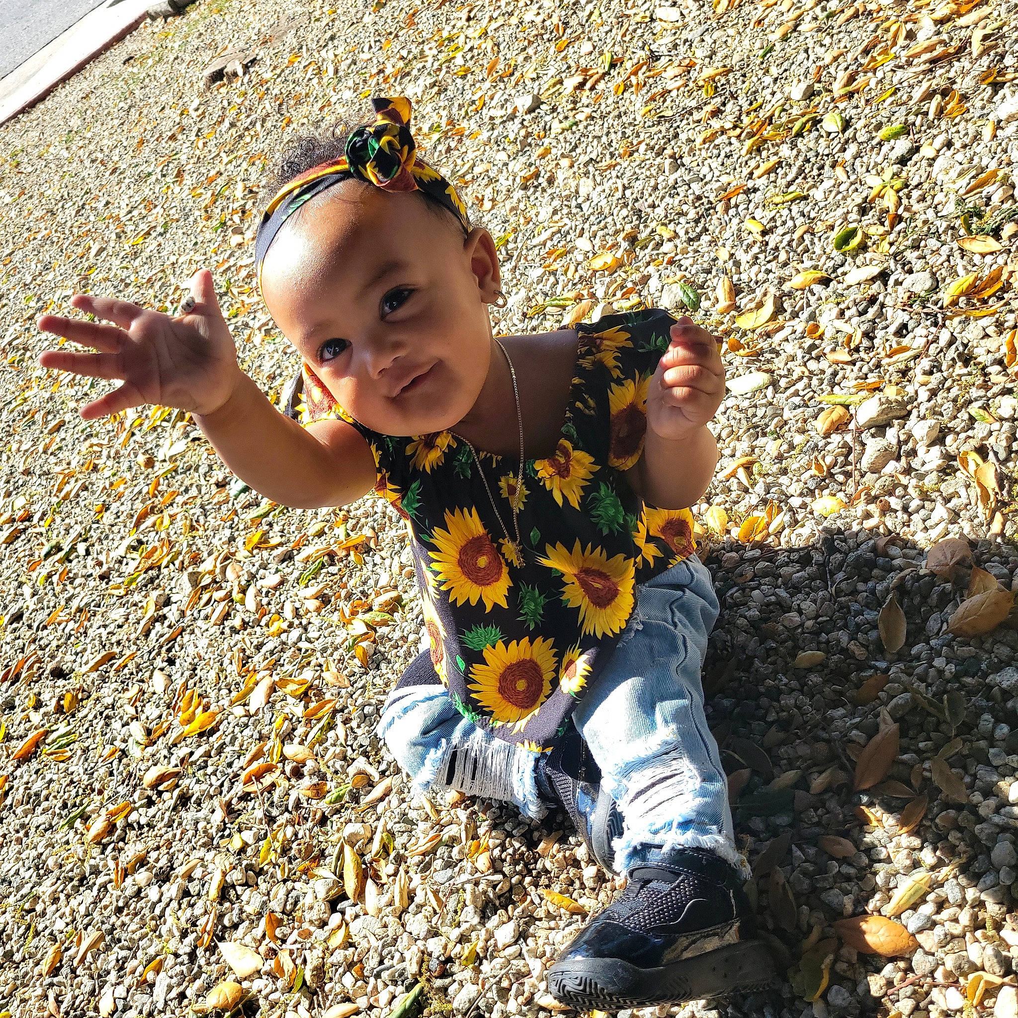 Jaziyah is registered to the contest to win money with this photo: asphalt, baby, baby_toddler_clothing, child, deciduous, flooring, fun, grass, happy, landscape, leaf, orange, people_in_nature, person, road_surface, sand, shadow, smile, soil, tints_and_shades