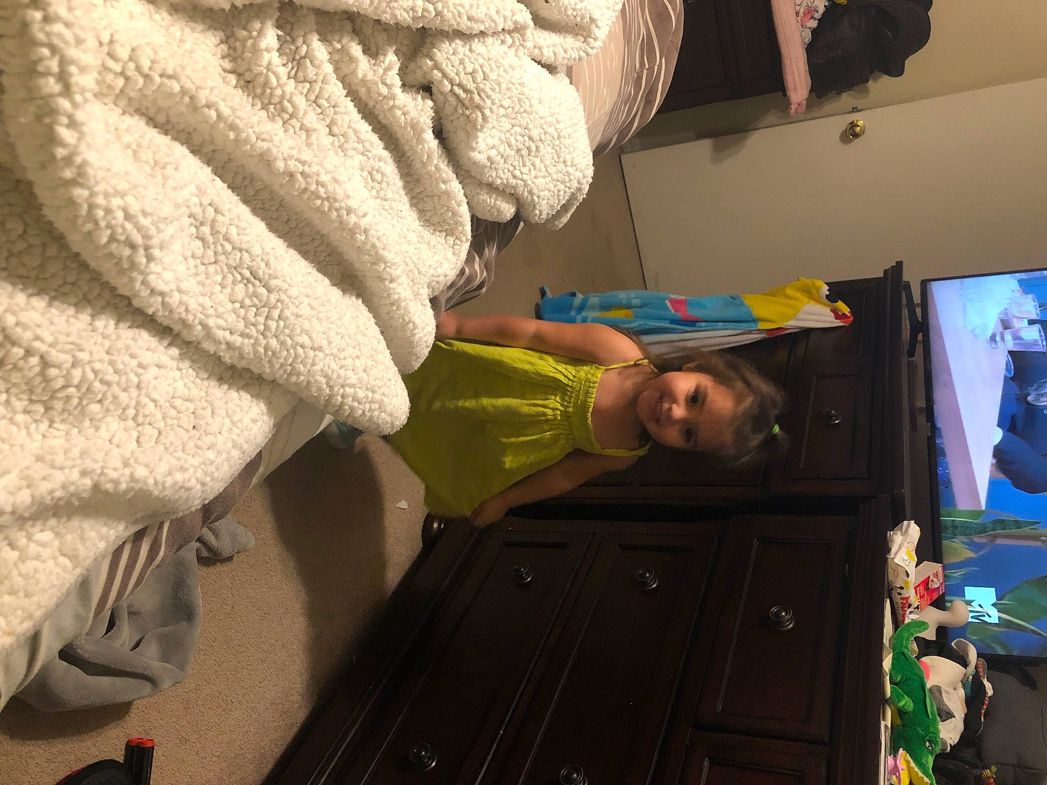 Addalynn is registered to the contest to win money with this photo: child, flooring, fun, joy, leisure, linens, person, play, room, television, thread, toddler, visual_arts, wood, wool