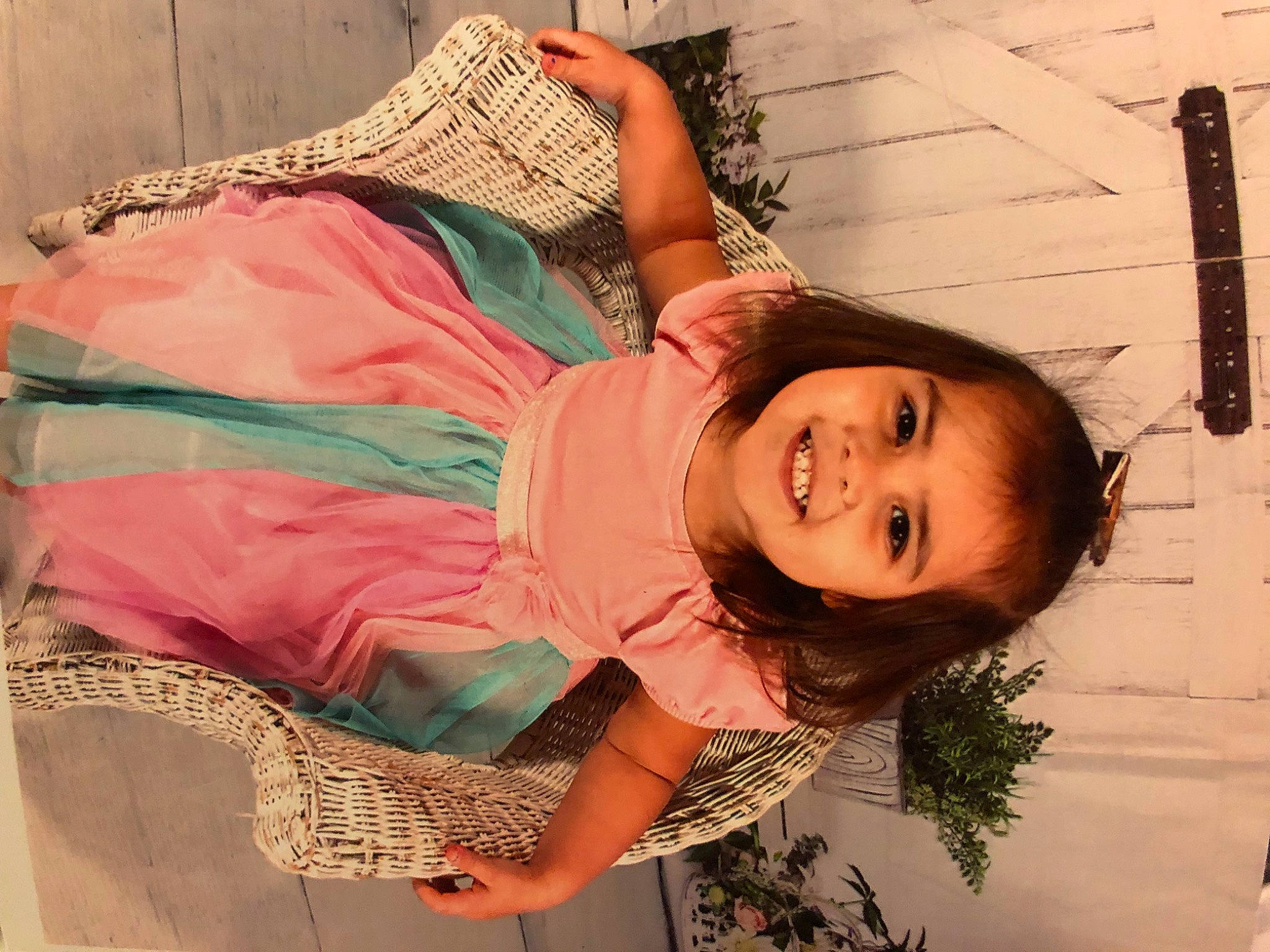 Addalynn is registered to the contest to win money with this photo: abdomen, child, dress, fun, grass, happy, human_body, joy, leisure, lip, magenta, mouth, pattern, peach, person, pink, plant, sitting, skin, smile