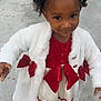 Harlee is registered to the contest to win money with this photo: child, girl, dress, coat, hair_accessories, necklace, sidewalk, outdoor, curly_hair, festive_clothing, red_bow, white_coat, shoes, smile, portrait, young_child, cute, holiday, fashion, person