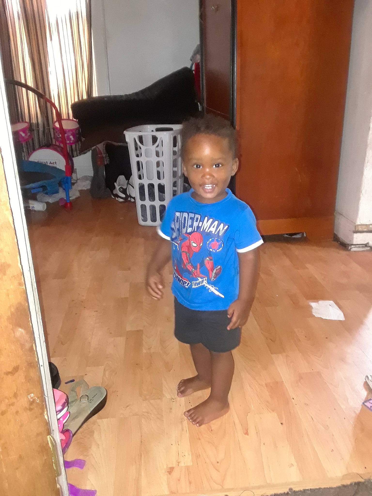 Kay'Leb is registered to the contest to win money with this photo: child, floor, flooring, hardwood, joy, leg, person, play, room, shoe, standing, toddler, wood