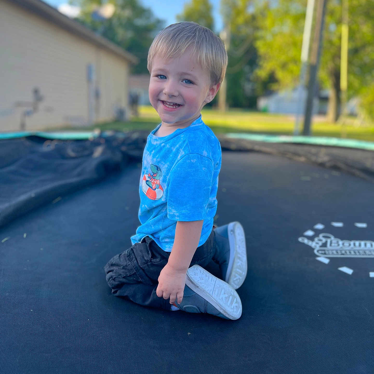 Maverick joined the competition — help win amazing prizes! boy, child, clothing, face, footwear, grass, happy, head, jeans, male, outdoors, pants, person, photography, plant, portrait, shoe, sitting, t_shirt, trampoline