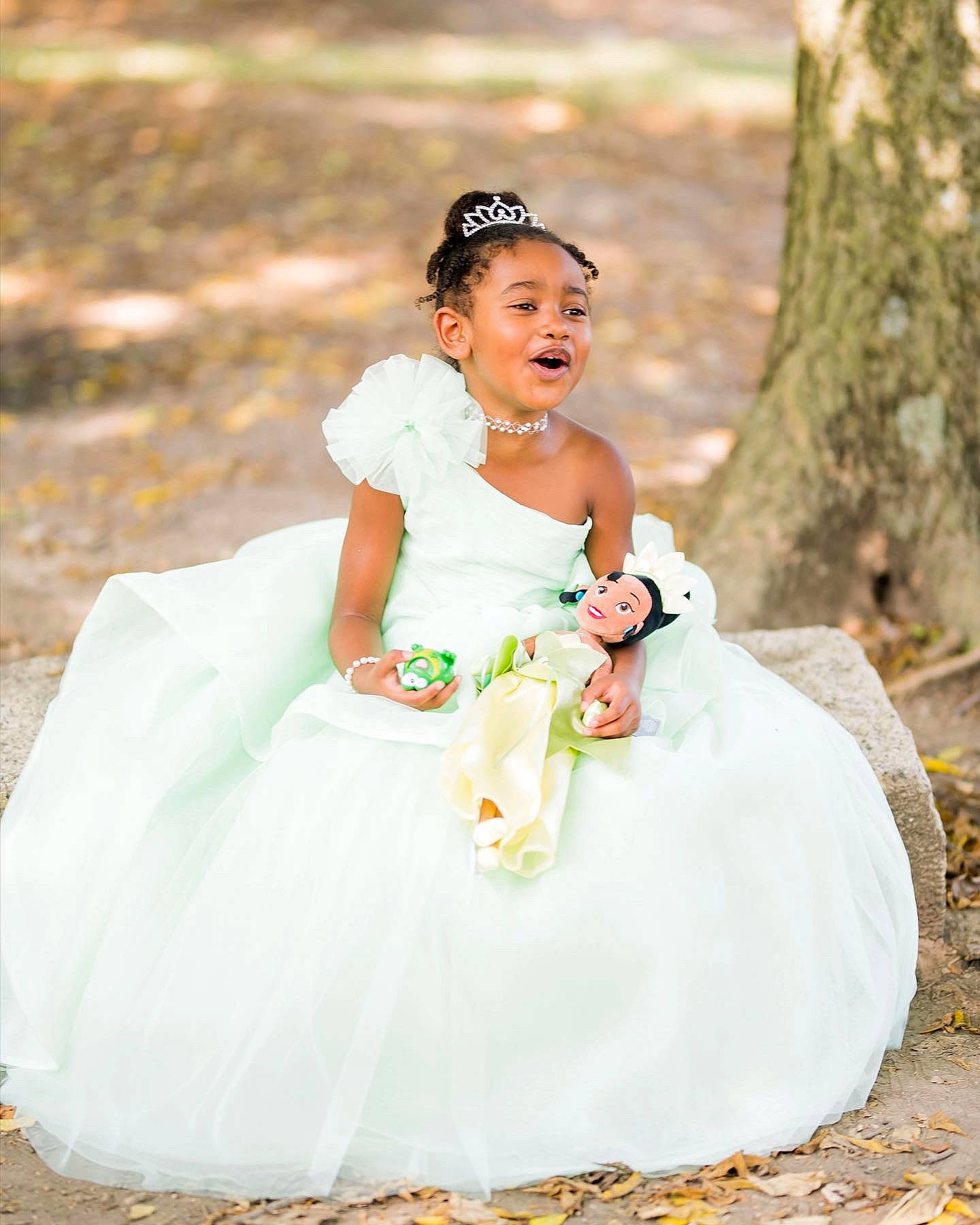 Mina is registered to the contest to win money with this photo: bridal_accessory, bridal_clothing, bridal_party_dress, bride, dress, event, flash_photography, formal_wear, gown, grass, hand, happy, headpiece, jewellery, people_in_nature, person, smile, toy, tree, wedding_ceremony_supply