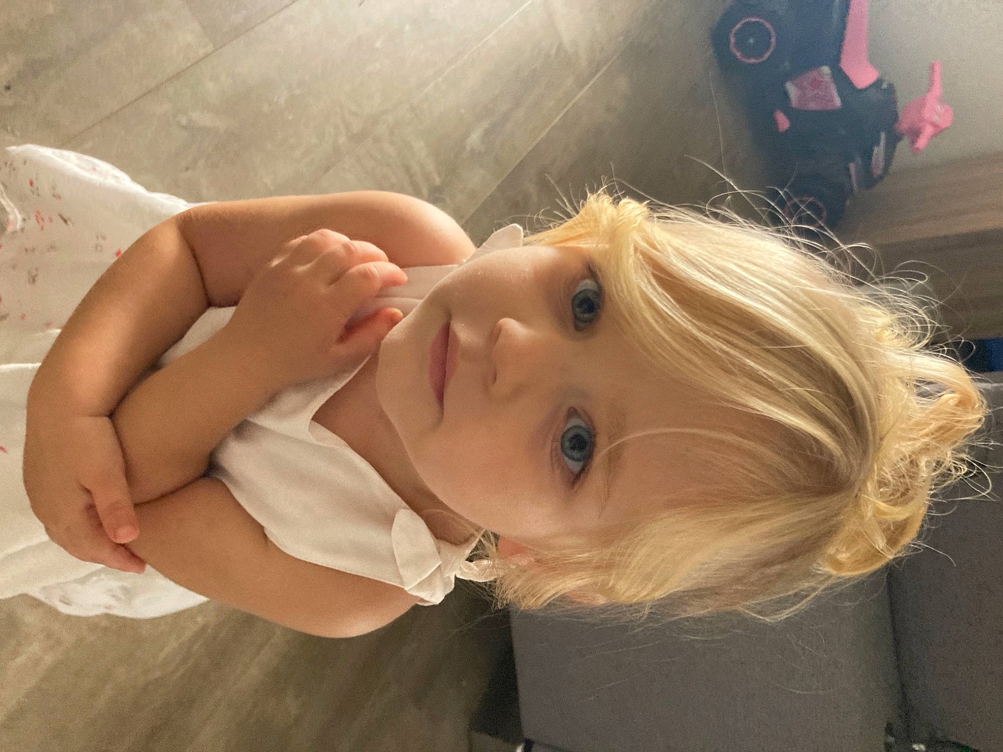 Anaë participe au concours pour gagner de l'argent avec cette photo : baby, cheek, chest, child, comfort, dress, ear, eyebrow, eyelash, gesture, happy, lip, long_hair, mammal, mouth, neck, nose, person, skin, smile