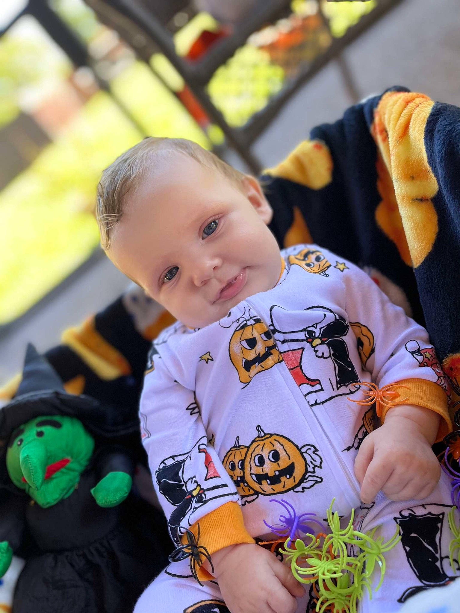 Tayson is registered to the contest to win money with this photo: baby, baby_products, child, event, fictional_character, fun, grass, hairstyle, happy, leisure, mammal, orange, people, person, personal_protective_equipment, play, recreation, sitting, t_shirt, toddler