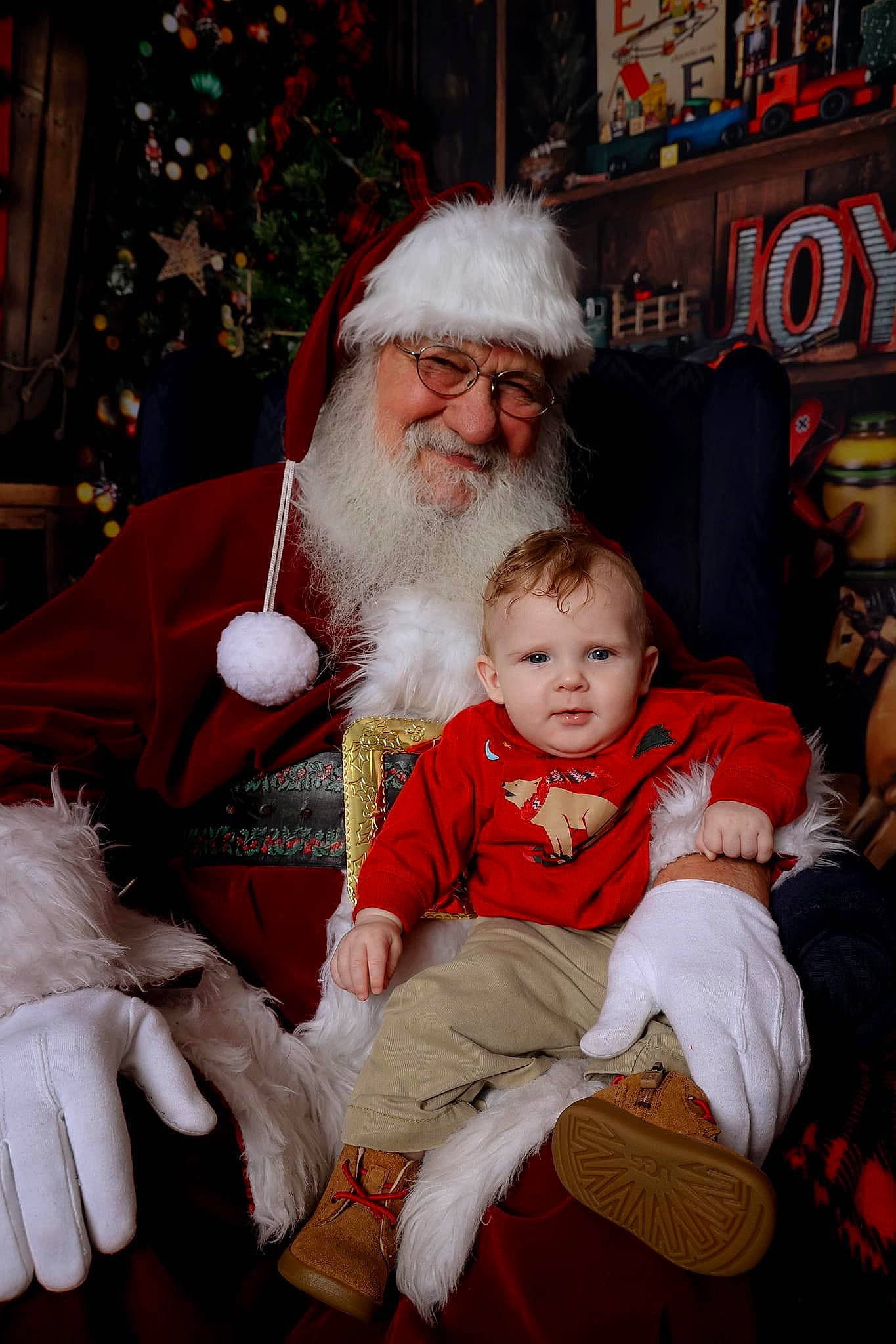 Tayson joined the competition — help win amazing prizes! baby, beard, christmas, christmas_decoration, christmas_eve, christmas_ornament, event, fictional_character, fun, happy, hat, headwear, holiday, human_body, joy, lap, person, red, santa_claus, smile