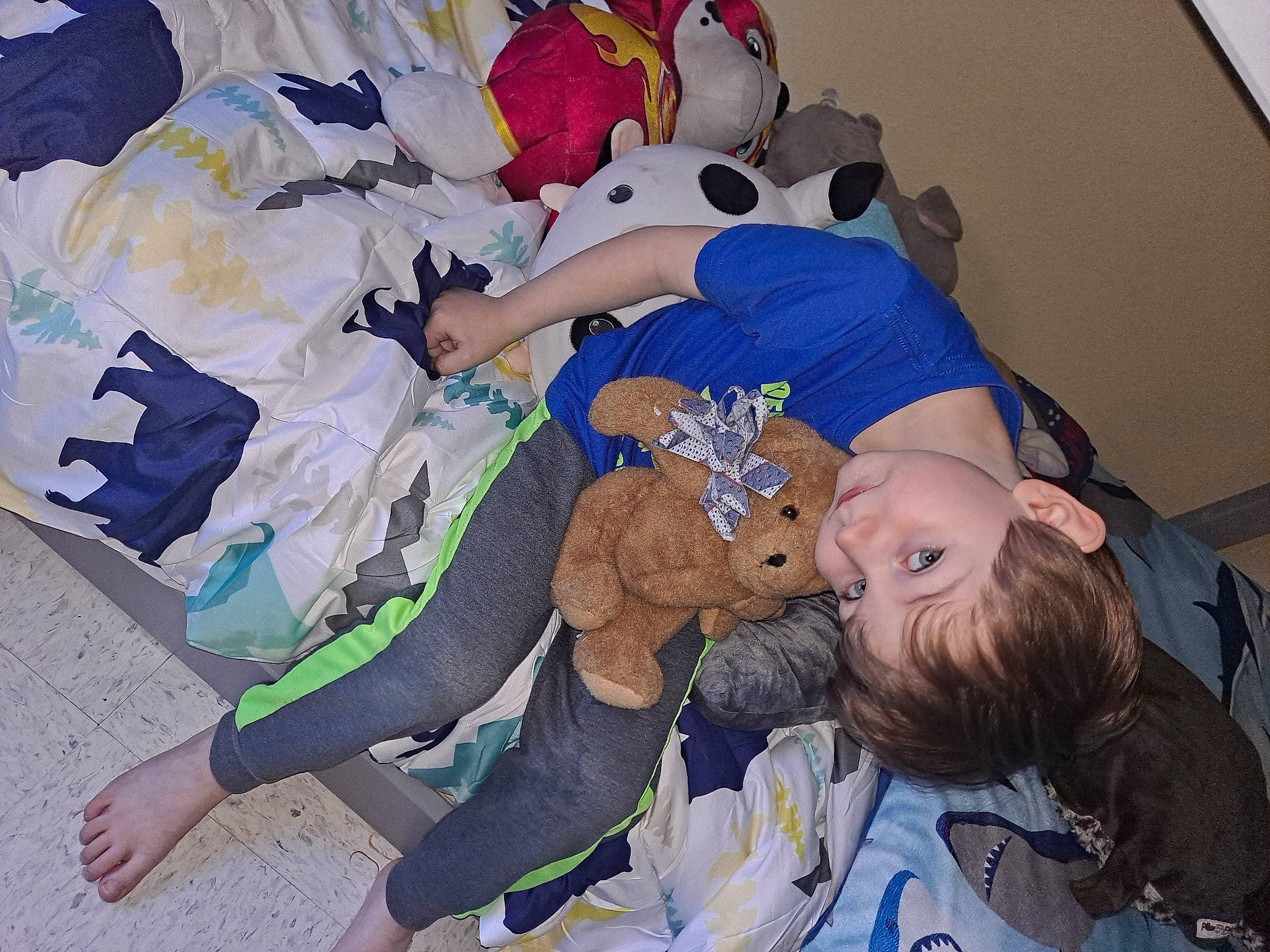 Nicolai is registered to the contest to win money with this photo: baby_products, baby_toddler_clothing, baseball_cap, bed, child, comfort, fictional_character, fun, happy, hat, linens, nap, pattern, person, room, sleep, stuffed_toy, toddler, toy