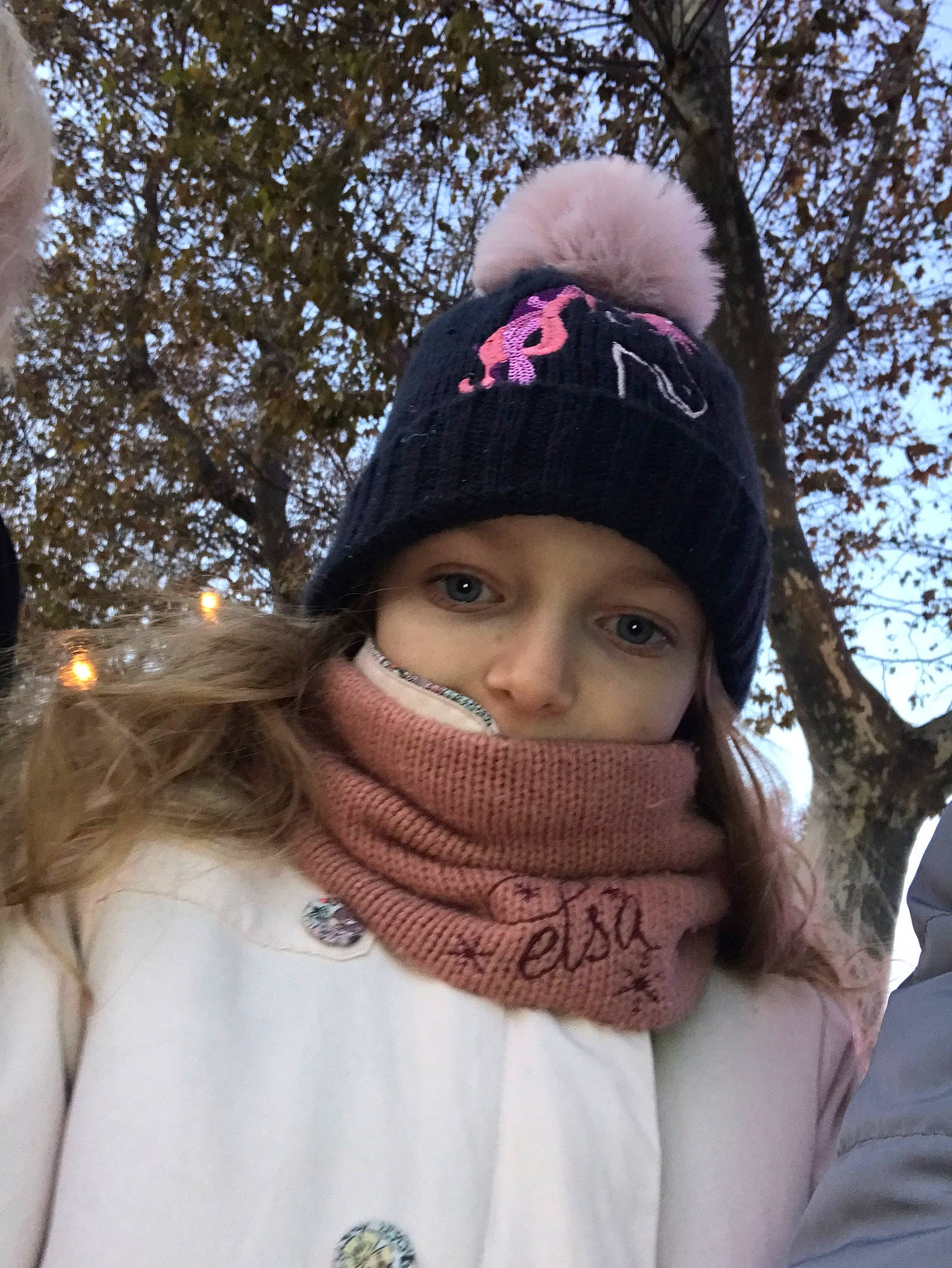 Rose participe au concours pour gagner de l'argent avec cette photo : beanie, cap, eyewear, fashion_accessory, freezing, fun, fur, headwear, jacket, knit_cap, magenta, person, playing_in_the_snow, recreation, scarf, shawl, snow, textile, tree, winter