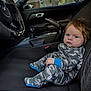 baby, blue_eyes, camouflage, car_interior, child, clothing, dashboard, gear_shift, hair, hand, leather, mustang, portrait, seat, seatbelt, side_mirror, steering_wheel, tree, window, young_child