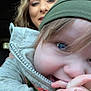 Ryder is registered to the contest to win money with this photo: baby, child, woman, face, smile, beanie, clothing, hand, blue_eyes, portrait, indoor, close_up, happy, person, jacket, candid, car, hair, skin, expression