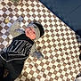 Ryder joined the competition — help win amazing prizes! baby, infant, nike, hat, blanket, checkered_pattern, pacifier, necklace, baby_powder, plush_toy, dragon_toy, nursery, clothing, indoor, cute, lying_down, child, person, soft_toys, cozy