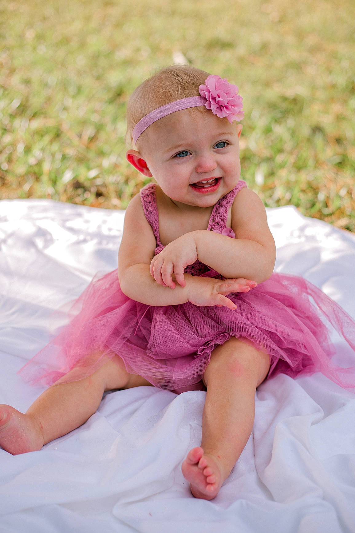 Erynn joined the competition — help win amazing prizes! baby, baby_toddler_clothing, beauty, child, dress, face, flash_photography, fun, grass, happy, headgear, headpiece, headwear, magenta, person, petal, pink, plant, purple, skin
