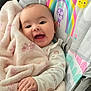 baby, blanket, smiling, happy, infant, child, face, hand, plush, soft, rainbow, sun, seat, clothing, cute, comfort, portrait, indoors, person, baby_seat