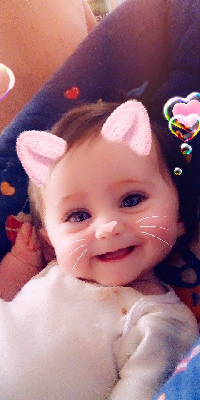 Tanya participe au concours pour gagner de l'argent avec cette photo : cheek, child, doll, ear, eye, eyebrow, face, finger, forehead, head, human_hair_color, infant, iris, joy, lip, mouth, nose, person, pink, product