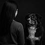 Aspiryne participe au concours pour gagner de l'argent avec cette photo : black_and_white, portrait, woman, dog, long_hair, looking_at, studio, dark_background, soft_lighting, intimate, expressive_eyes, animal, human, side_view, monochrome, calm, indoor, companion, pet, fur