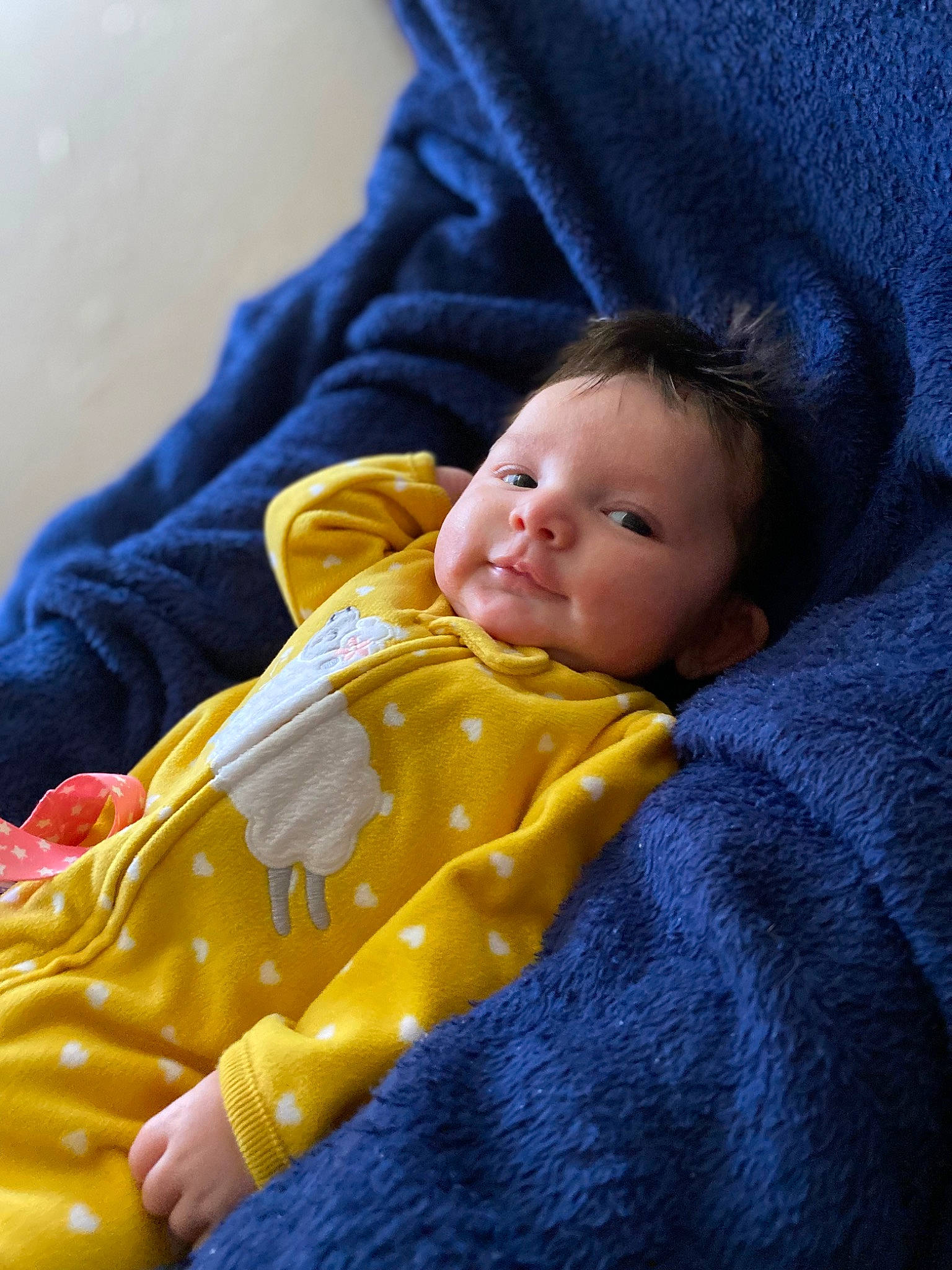 Laurel is registered to the contest to win money with this photo: baby, baby_toddler_clothing, cheek, child, chin, close_up, comfort, electric_blue, face, facial_expression, happy, human, linens, nose, outerwear, person, skin, sleeve, textile, toddler