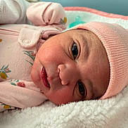 Brooklynn is registered to the contest to win money with this photo: baby, beanie, blanket, bodypart, bonnet, cap, clothing, face, finger, hand, happy, hat, head, hood, newborn, person, photography, portrait, smile, towel