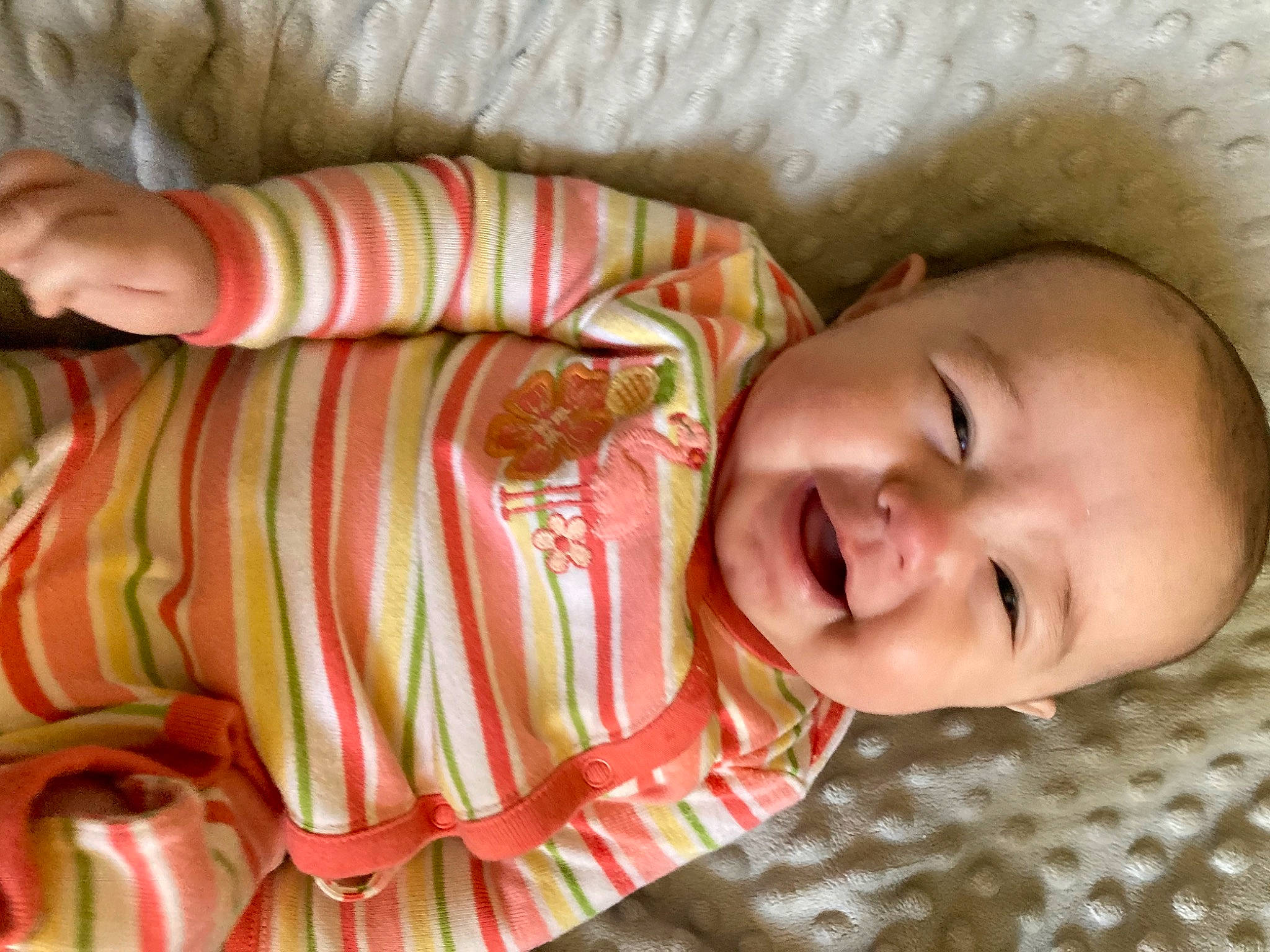 Kahmila is registered to the contest to win money with this photo: baby, baby_laughing, baby_toddler_clothing, cheek, child, comfort, eye, face, happy, head, iris, linens, lip, mouth, nose, pattern, person, skin, sleeve, smile
