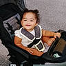 Miah'Ja joined the competition — help win amazing prizes! toddler, child, stroller, harness, toy, pavement, outdoor, person, walking, smiling, hair_buns, clothing, footwear, seat, baby, plaything, reflection, happy, infant, transportation