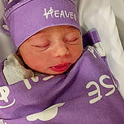 Heaven joined the competition — help win amazing prizes! newborn, baby, sleeping, wrapped, purple_blanket, hat, hospital, bassinet, pacifier, infant, cute, peaceful, face, clothing, indoors, resting, child, soft, tiny, portrait