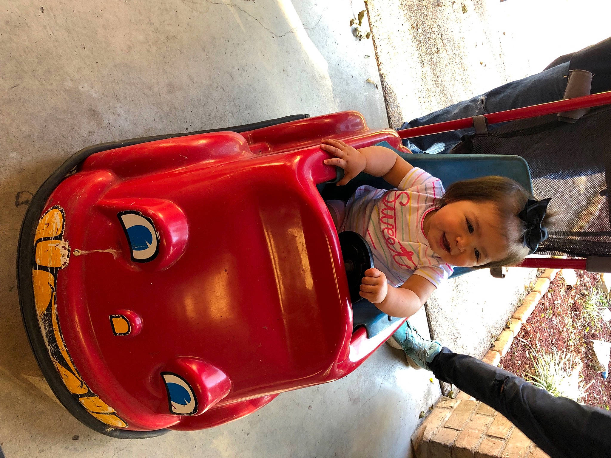 Everleigh is registered to the contest to win money with this photo: auto_part, automotive_design, automotive_exterior, automotive_lighting, bumper, child, classic, fender, fun, leisure, mode_of_transport, motor_vehicle, person, recreation, t_shirt, tire, toddler, travel, vehicle, vehicle_door