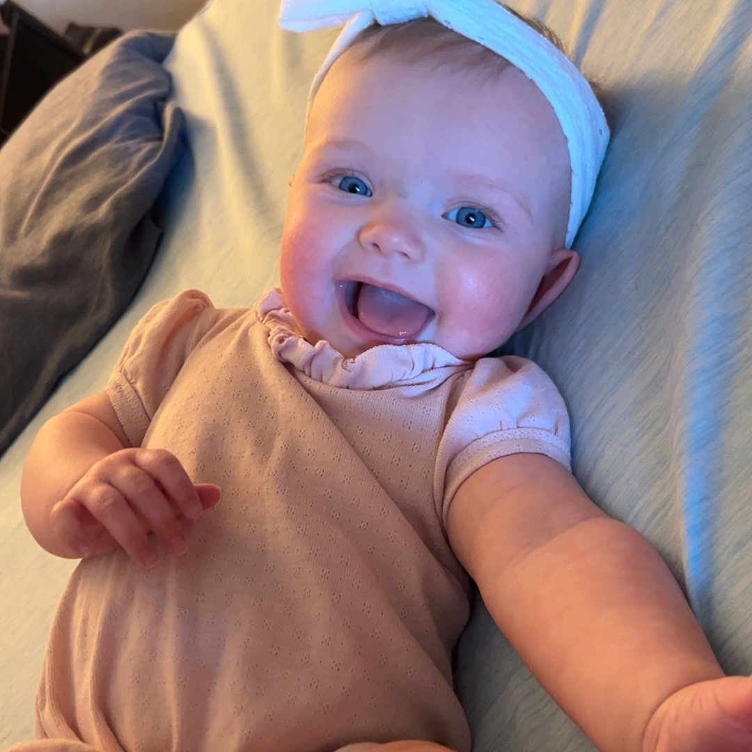 Aria joined the competition — help win amazing prizes! baby, bed, bodypart, clothing, couch, cushion, face, finger, furniture, hand, happy, hat, head, homedecor, newborn, person, photography, portrait, smile, toy