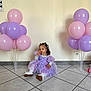 toddler, child, balloons, lavender_dress, pastel_colors, indoor, floor_tiles, sitting, cute, party, celebration, curious, young_child, shoes, long_hair, white_socks, wall, electric_socket, decor, festive