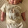 Justin joined the competition — help win amazing prizes! baby, infant, smile, hat, elephant, shirt, clothing, blanket, cute, lying_down, happy, child, toddler, portrait, texture, beige, soft, comfort, casual, indoors