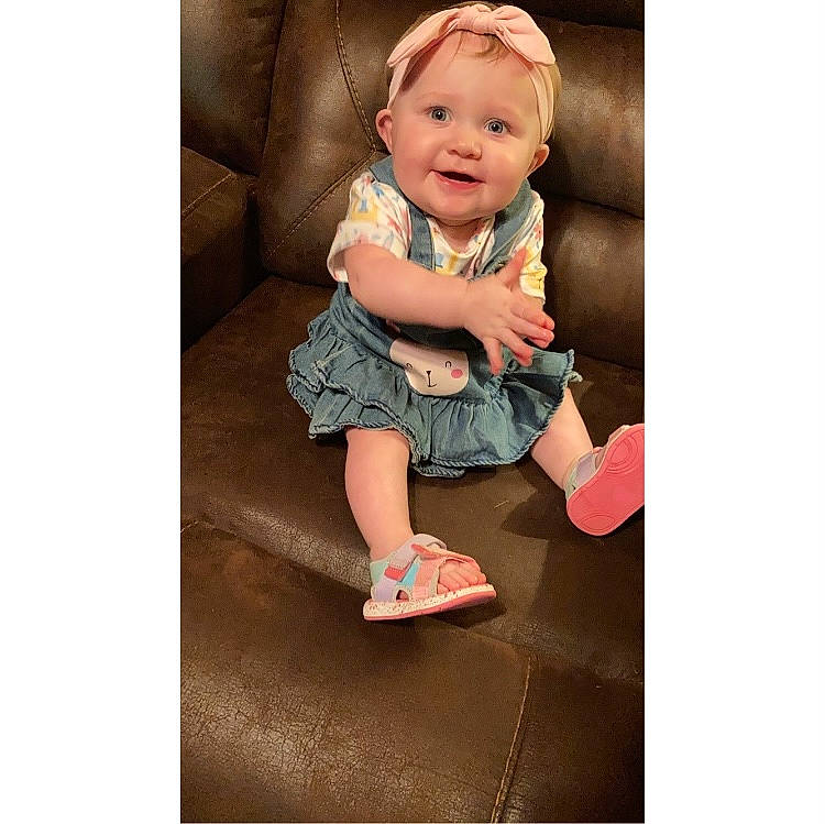 Heidi joined the competition — help win amazing prizes! baby, baby_toddler_clothing, child, collar, denim, dress, fashion_accessory, footwear, hair, happy, human_body, human_leg, joy, pattern, person, shorts, sitting, sleeve, smile, suit