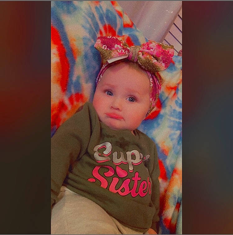 Heidi joined the competition — help win amazing prizes! art, baby, baby_toddler_clothing, cheek, child, costume_hat, eyebrow, fashion_accessory, happy, head, headpiece, magenta, orange, paint, pattern, peach, person, pink, sleeve, t_shirt