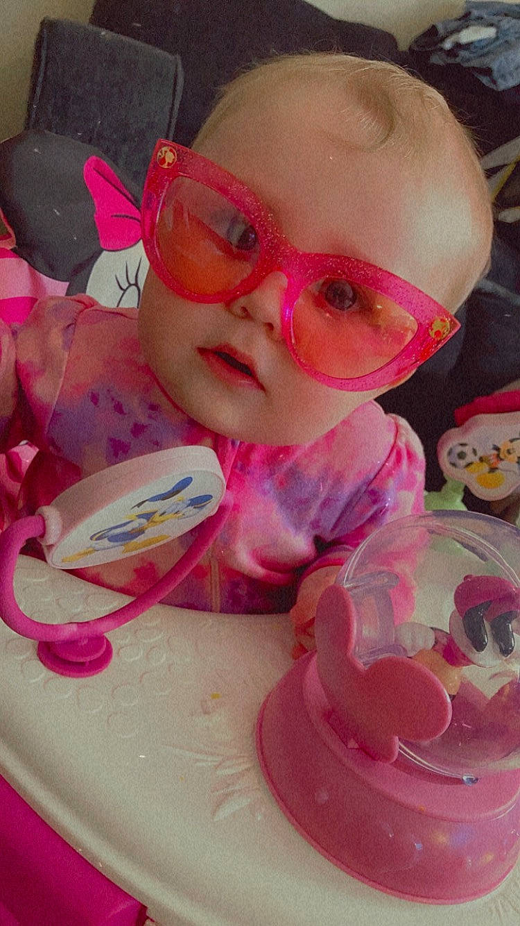 Heidi joined the competition — help win amazing prizes! baby_toddler_clothing, cheek, child, costume_hat, cup, dishware, drinkware, eyewear, fun, goggles, magenta, person, personal_protective_equipment, pink, plate, serveware, sunglasses, sweetness, tableware, toddler
